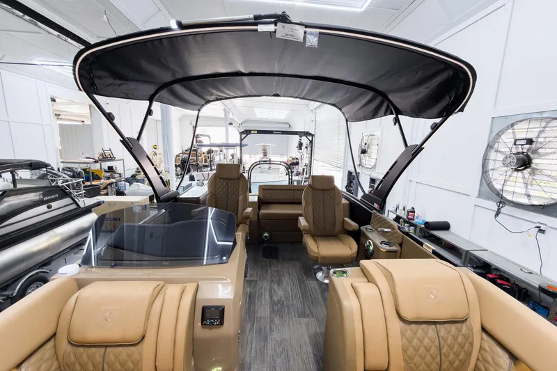 Slide: The Image of Luxurious 2026 Godfrey Sanpan 25' Tritoon interior with plush seating and modern design. - 55