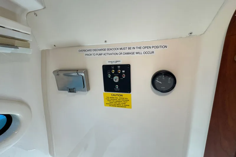 Slide: The Image of 2024 Grady-White Marlin 300 boat bathroom with sink, toilet, and storage. - 10