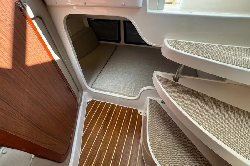 Slide: The Image of Control panel on 2024 Grady-White Marlin 300 boat with caution labels and gauge. - 11