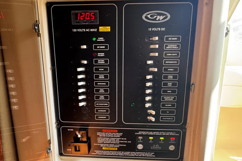 Slide: The Image of 2024 Grady-White Marlin 300 cabin interior with cozy bed and modern lighting. - 14