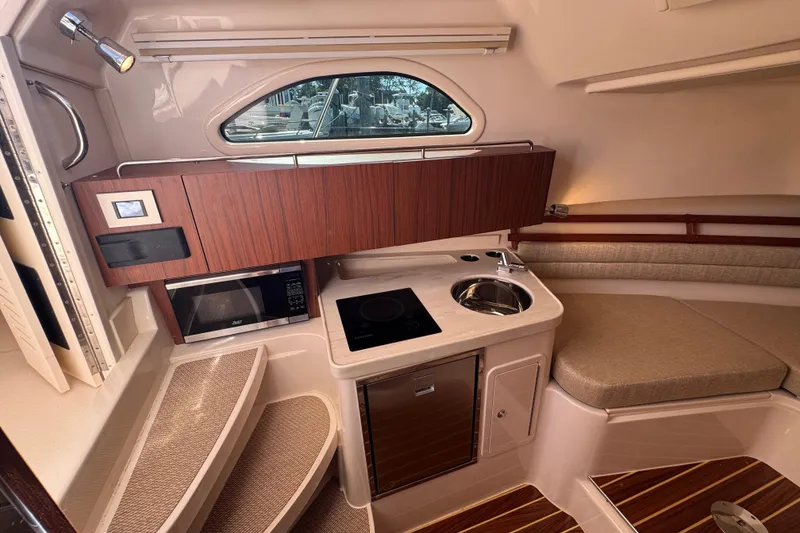 Slide: The Image of Control panel of a 2024 Grady-White Marlin 300 boat, showing engine and oil pressure indicators. - 16