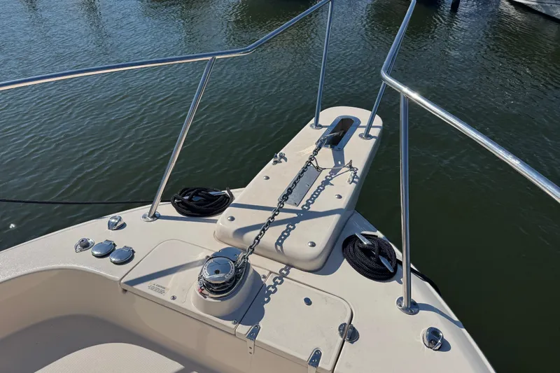 Slide: The Image of 2024 Grady-White Marlin 300 cabin interior with skylight and cushioned seating. - 28