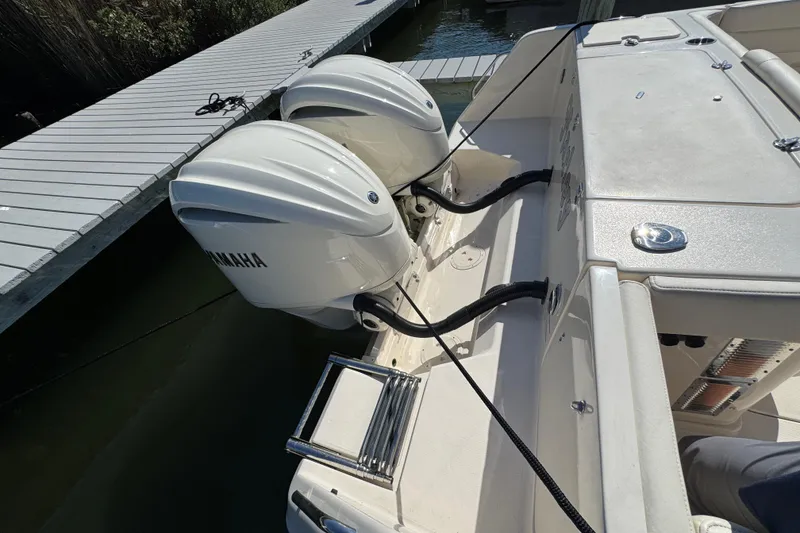Slide: The Image of 2024 Grady-White Marlin 300 with twin Yamaha outboard engines at dock. - 40