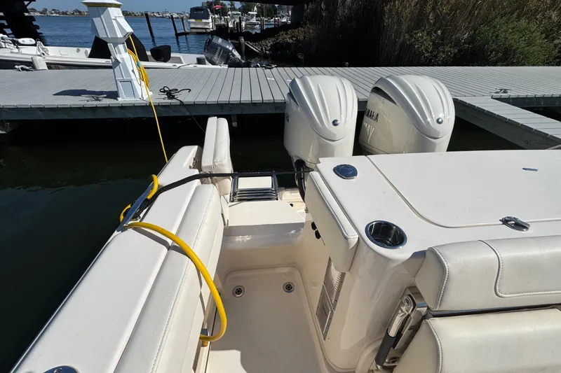 Slide: The Image of 2024 Grady-White Marlin 300 with twin Yamaha outboard engines at dock. - 41