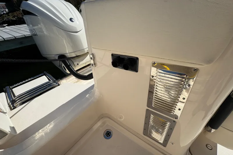 Slide: The Image of 2024 Grady-White Marlin 300 boat with twin Yamaha engines docked at marina. - 42