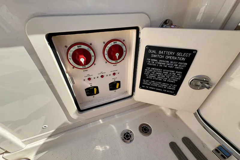 Slide: The Image of 2024 Grady-White Marlin 300 boat interior, featuring spacious seating and dockside view. - 46