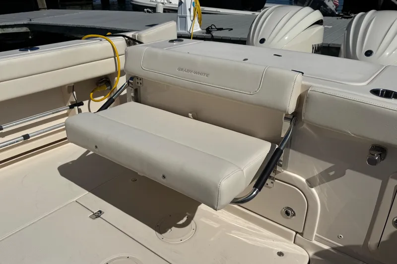 Slide: The Image of 2024 Grady-White Marlin 300 boat interior with foldable seating and Yamaha engines. - 49