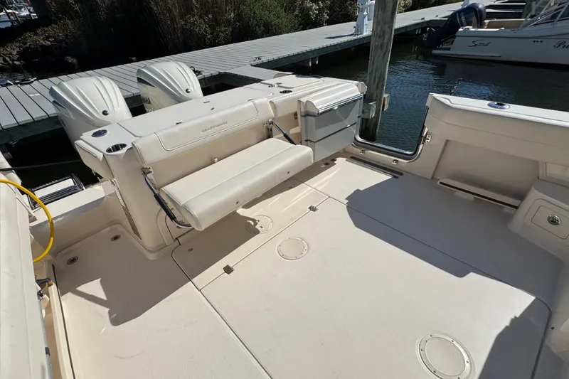 Slide: The Image of 2024 Grady-White Marlin 300 boat with foldable seat and dual engines. - 50