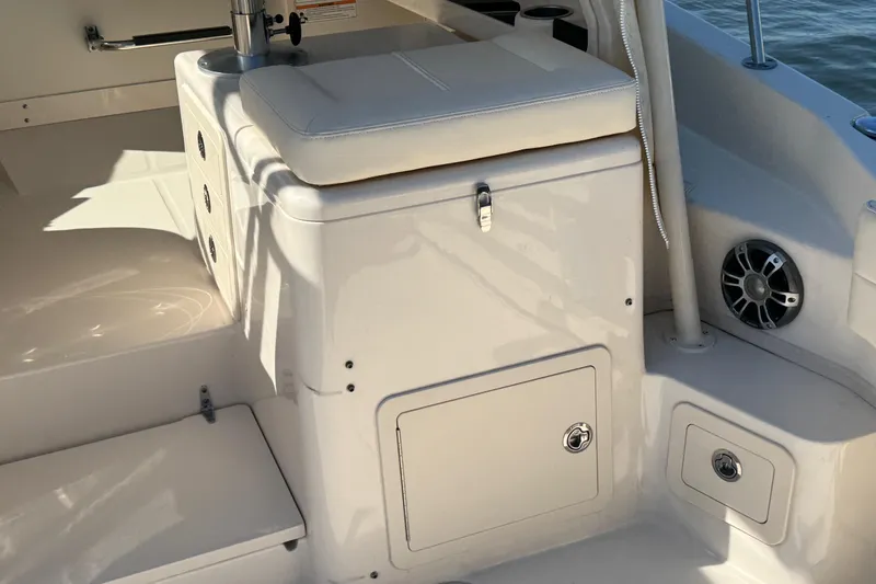 Slide: The Image of 2024 Grady-White Marlin 300 boat interior with helm, seating, and clear skies. - 57