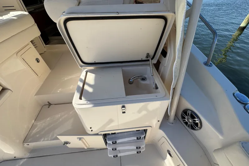 Slide: The Image of 2024 Grady-White Marlin 300 boat interior with seating and storage compartments. - 58