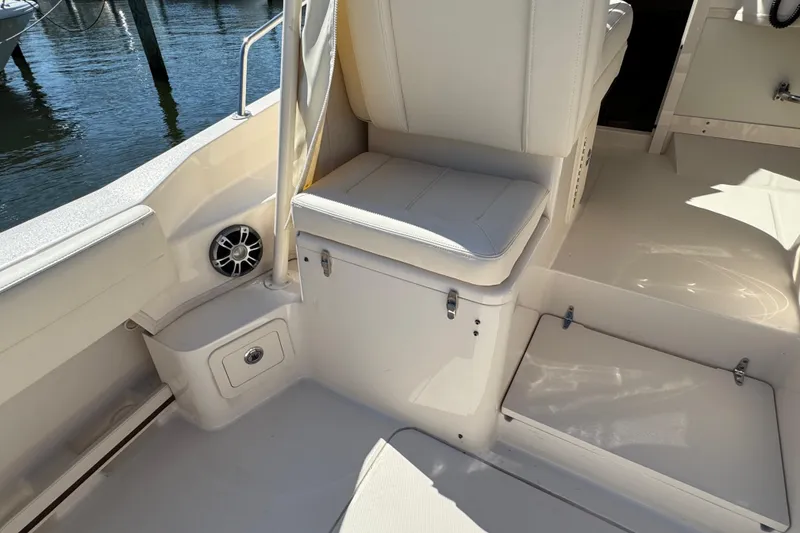 Slide: The Image of 2024 Grady-White Marlin 300 boat interior with open storage, dockside view. - 60