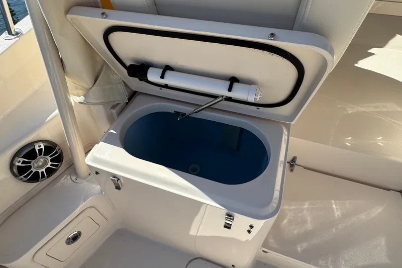 Slide: The Image of 2024 Grady-White Marlin 300 boat interior with white seating and storage compartments. - 61