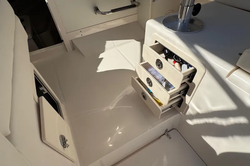 Slide: The Image of 2024 Grady-White Marlin 300 boat interior with open storage compartment. - 62
