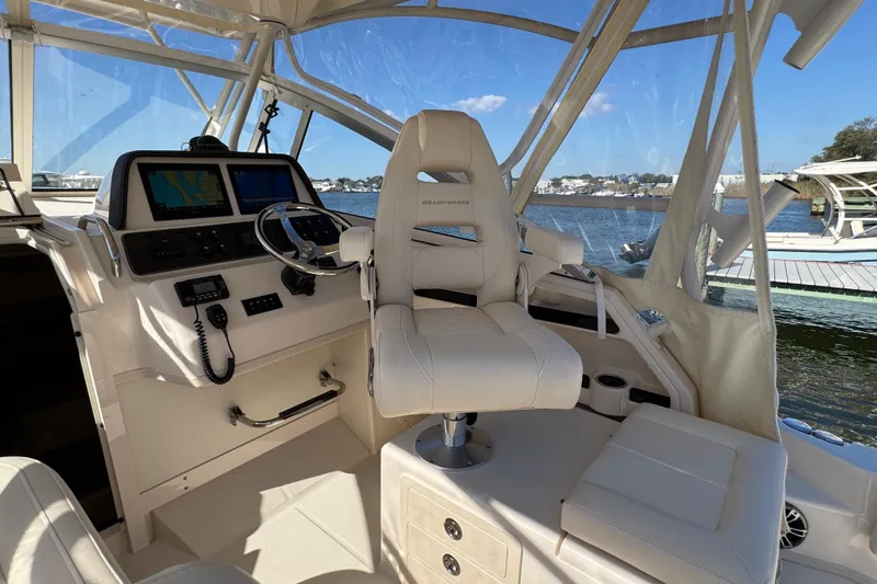 Slide: The Image of 2024 Grady-White Marlin 300 interior with open storage drawers and sleek design. - 63