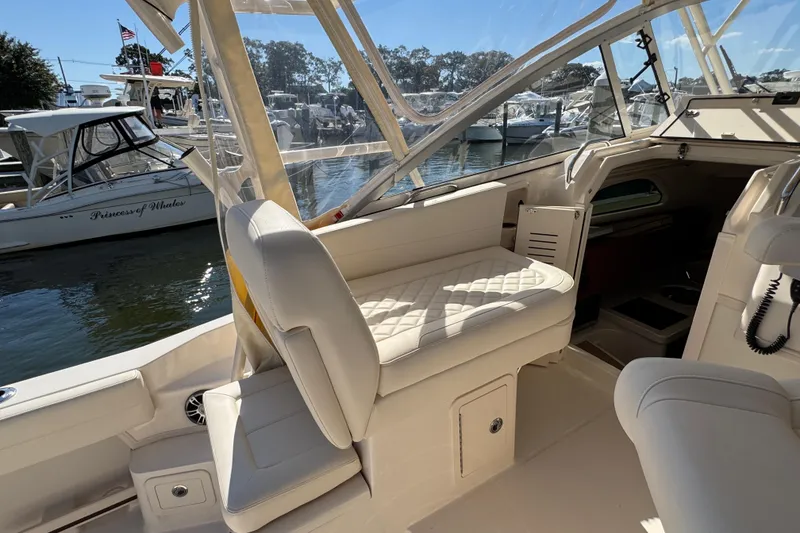 Slide: The Image of 2024 Grady-White Marlin 300 helm with modern controls and comfortable seating. - 64