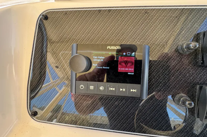 Slide: The Image of 2024 Grady-White Marlin 300 helm with dual navigation screens and control panel. - 67