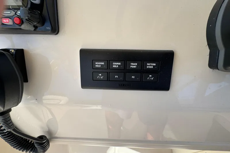 Slide: The Image of 2024 Grady-White Marlin 300 boat controls with advanced navigation system. - 72