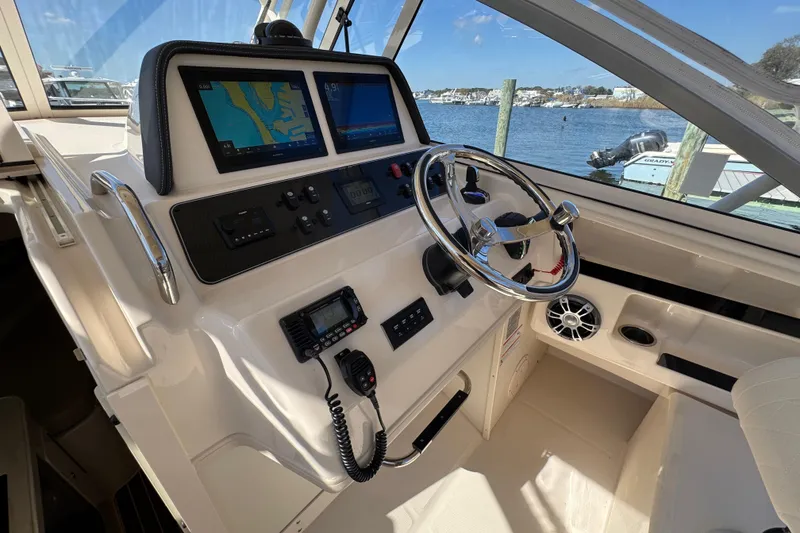 Slide: The Image of Yamaha display showing trip data on 2024 Grady-White Marlin 300 boat. - 74