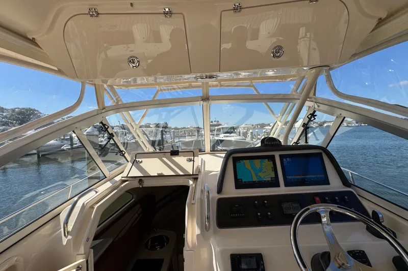 Slide: The Image of 2024 Grady-White Marlin 300 boat interior with luxurious seating and helm station. - 78