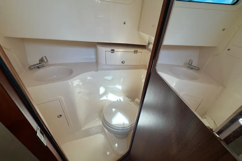 Slide: The Image of 2024 Grady-White Marlin 300 boat docked with twin Yamaha engines. - 8