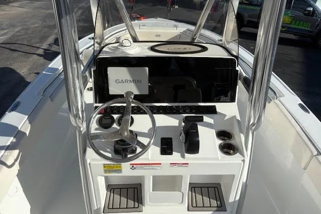 Slide: The Image of 2025 Sea Hunt Ultra 219 boat console with Garmin navigation system and steering wheel. - 10