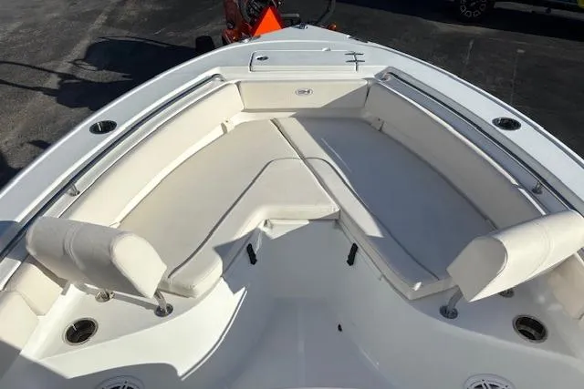 Slide: The Image of 2025 Sea Hunt Ultra 219 boat with spacious seating and sleek design. - 28