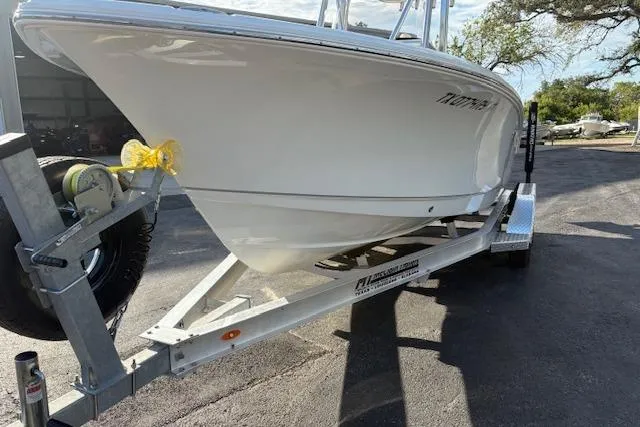 Slide: The Image of 2025 Sea Hunt Ultra 219 boat on trailer, parked outdoors. - 5