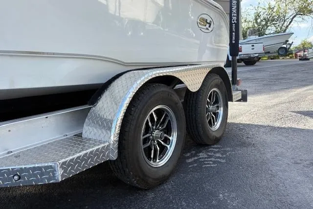 Slide: The Image of Trailer with dual wheels for 2025 Sea Hunt Ultra 219 boat. - 7