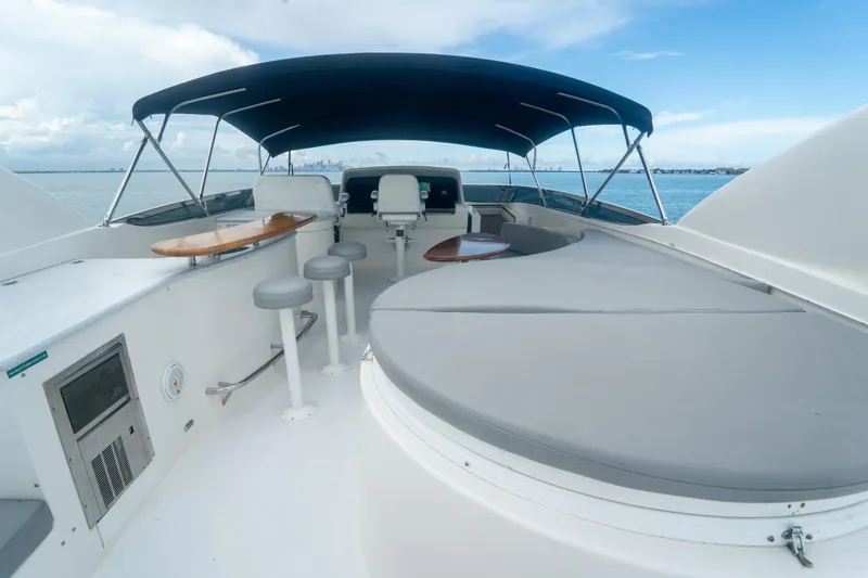 Slide: The Image of 2008 Lazzara 84 Open Bridge yacht with spacious deck and seating under canopy. - 16