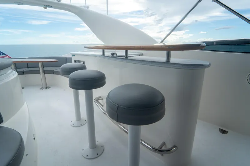 Slide: The Image of Luxurious 2008 Lazzara 84 Open Bridge yacht with elegant seating and ocean view. - 17