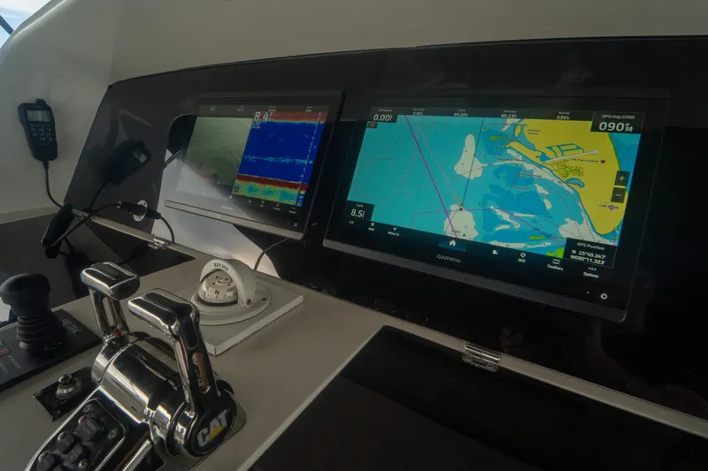 Slide: The Image of Control panel of 2008 Lazzara 84 Open Bridge yacht with navigation screens. - 20