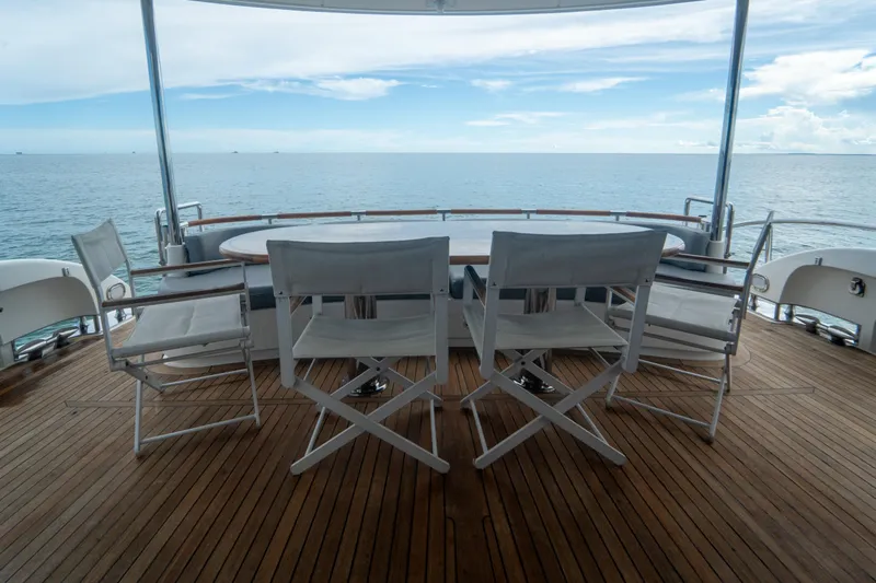 Slide: The Image of Luxury yacht deck with chairs, ocean view; 2008 Lazzara 84 Open Bridge. - 21