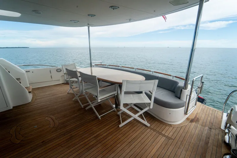 Slide: The Image of Luxurious 2008 Lazzara 84 Open Bridge yacht deck with seating and ocean view. - 22