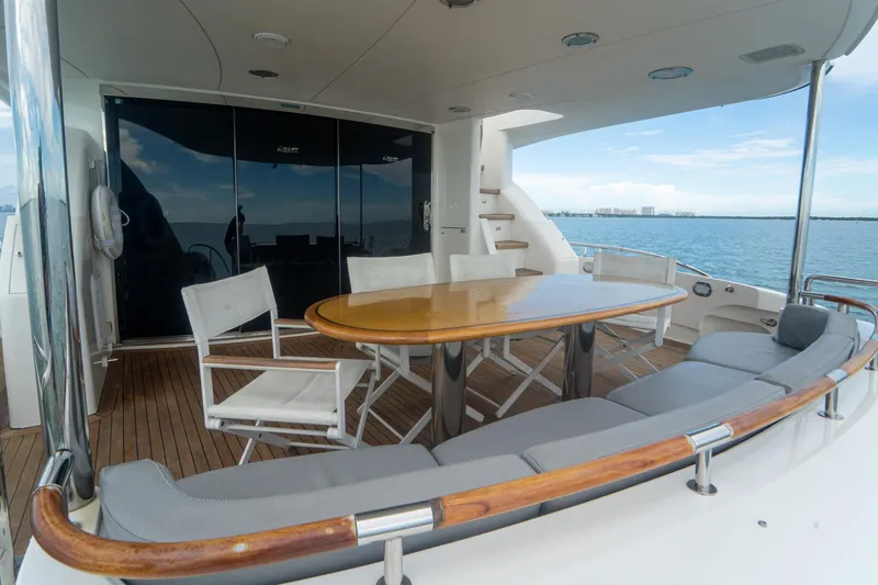Slide: The Image of Luxurious 2008 Lazzara 84 Open Bridge yacht deck with seating and ocean view. - 23