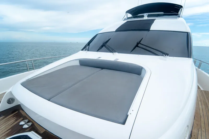 Slide: The Image of 2008 Lazzara 84 Open Bridge yacht with sleek design on open sea. - 26