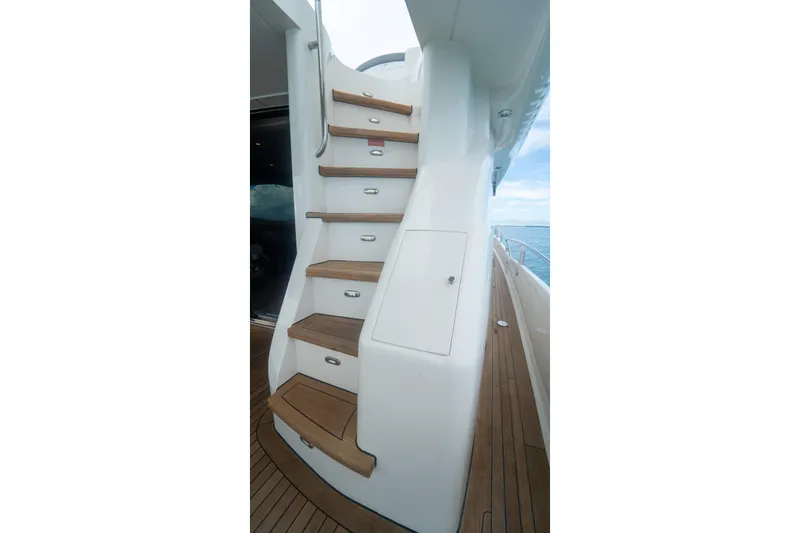 Slide: The Image of Staircase on 2008 Lazzara 84 Open Bridge yacht with teak steps and ocean view. - 27