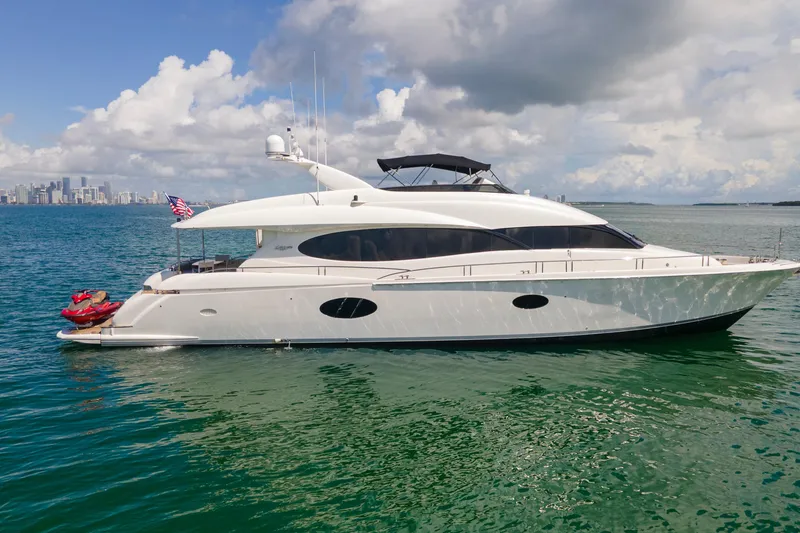 Slide: The Image of Luxury 2008 Lazzara 84 Open Bridge yacht cruising on clear blue waters. - 4