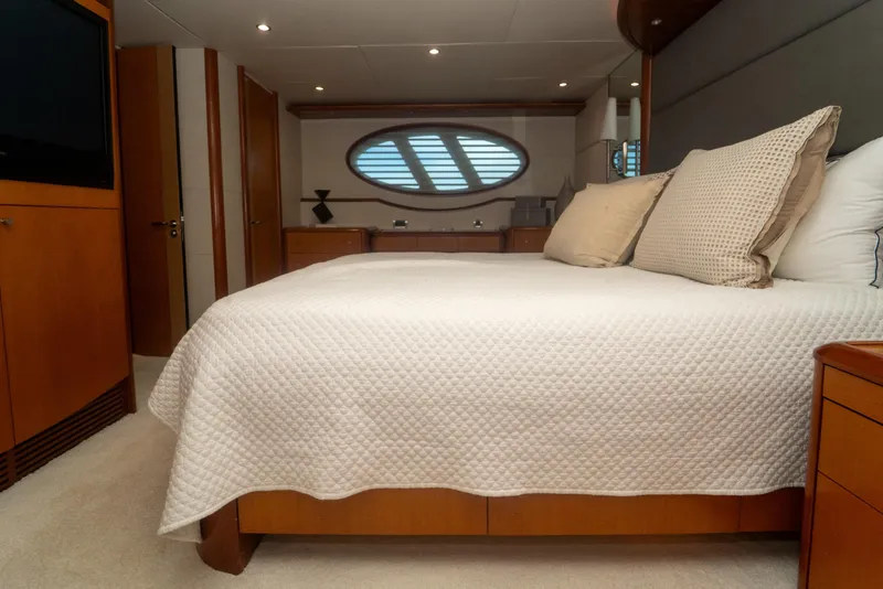 Slide: The Image of Luxurious bedroom interior of 2008 Lazzara 84 Open Bridge yacht with elegant bedding. - 40