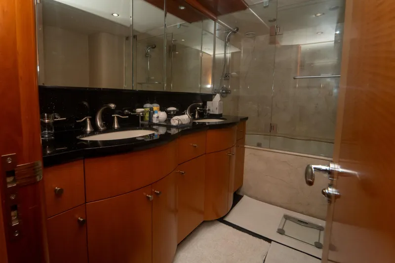 Slide: The Image of Luxurious bathroom in 2008 Lazzara 84 Open Bridge yacht with elegant wood cabinetry. - 41