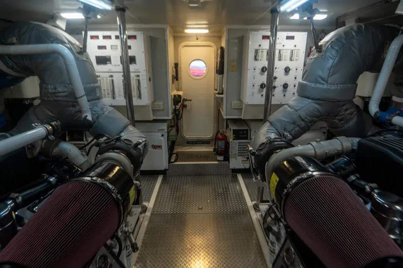 Slide: The Image of Engine room of 2008 Lazzara 84 Open Bridge yacht, featuring complex machinery and control panels. - 45