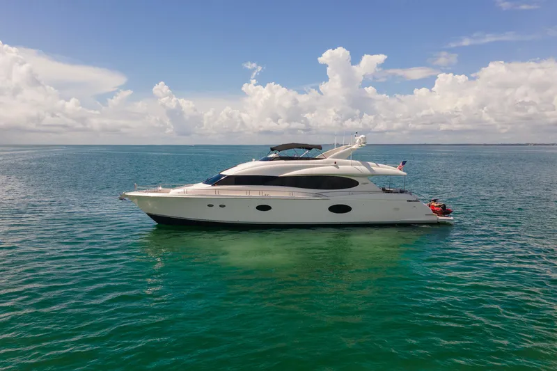 Slide: The Image of 2008 Lazzara 84 Open Bridge yacht on calm ocean waters under a clear sky. - 6