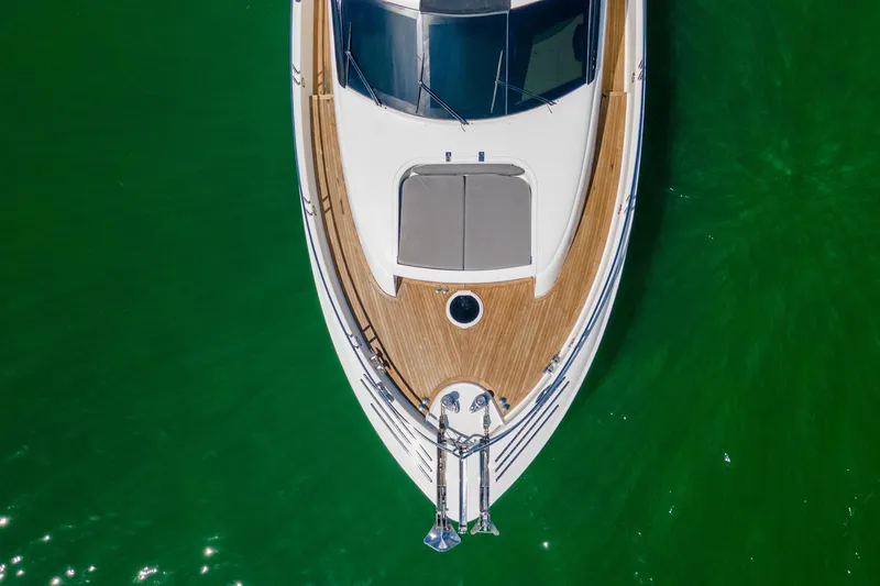 Slide: The Image of Aerial view of 2008 Lazzara 84 Open Bridge yacht on vibrant green water. - 8