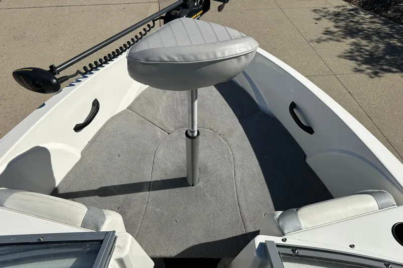 Slide: The Image of 2013 Larson LX 180S OB boat interior with gray seating and carpeted floor. - 4