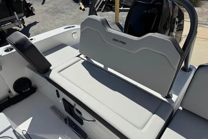 Slide: The Image of 2026 Sea Pro 245FLX Sandbar boat interior with cushioned seating and storage. - 12