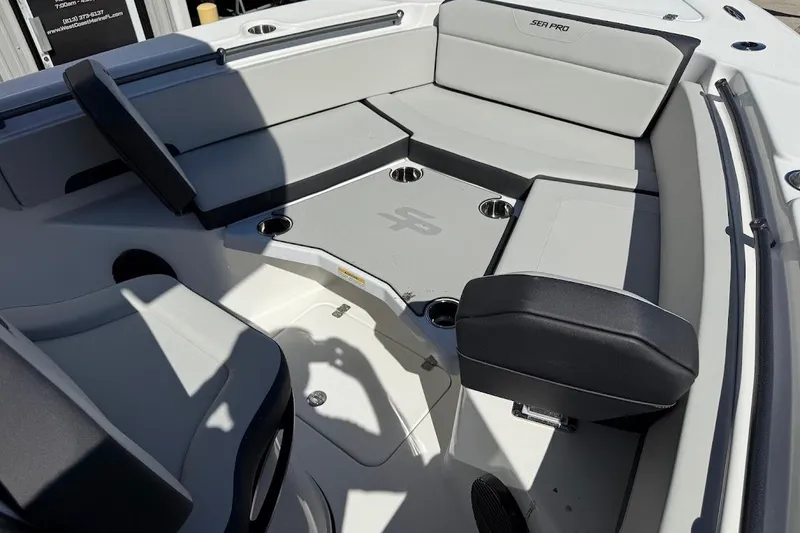 Slide: The Image of 2026 Sea Pro 245FLX Sandbar boat interior with seating and cup holders. - 15