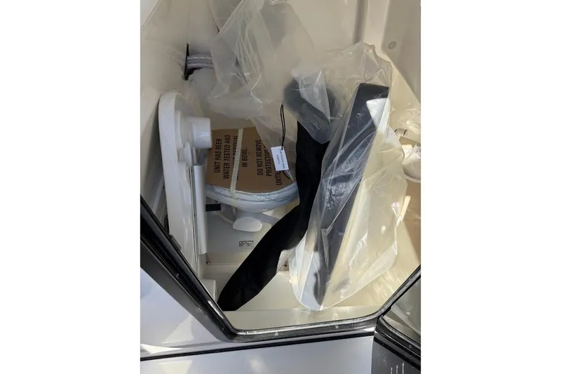 Slide: The Image of Interior of 2026 Sea Pro 245FLX Sandbar boat with packaged equipment. - 17