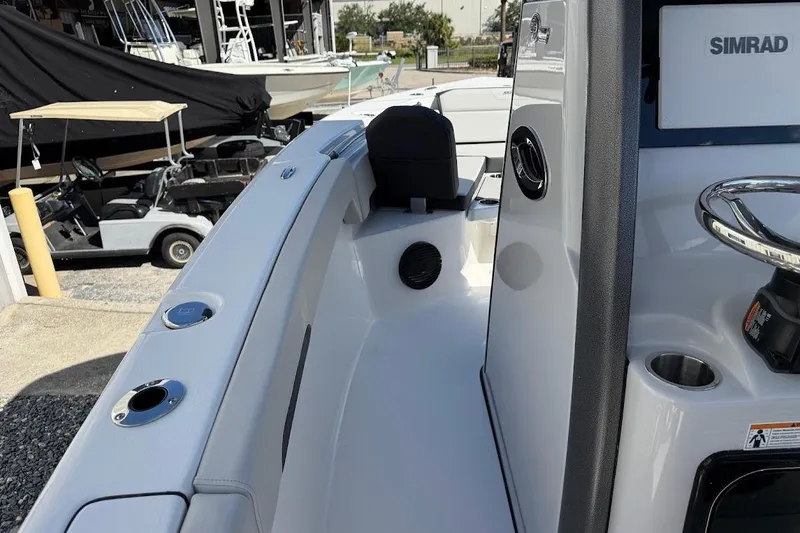 Slide: The Image of 2026 Sea Pro 245FLX Sandbar boat interior with Simrad electronics and sleek design. - 19