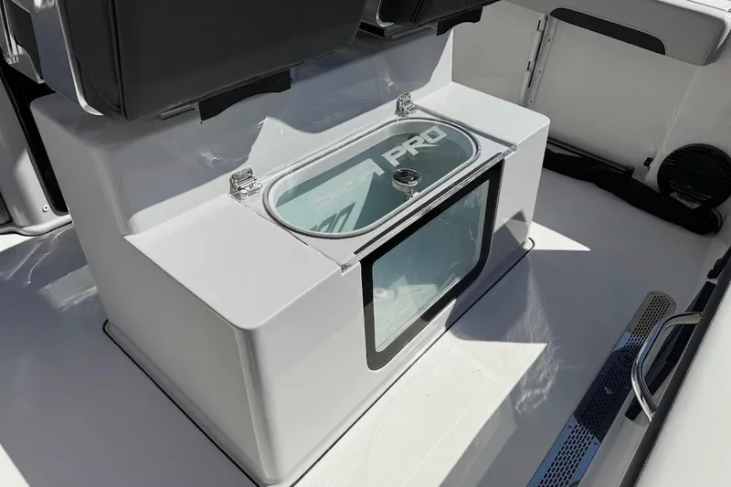 Slide: The Image of 2026 Sea Pro 245FLX Sandbar boat interior with storage compartment and seating. - 20