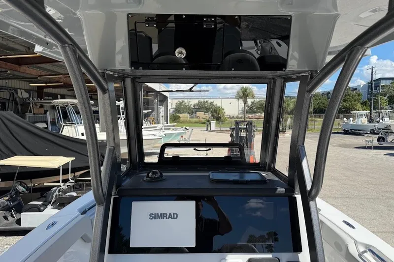 Slide: The Image of 2026 Sea Pro 245FLX Sandbar boat interior with Simrad navigation system. - 8