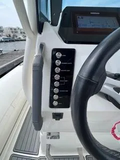 Slide: The Image of Control panel of 2026 Brig Eagle 8 boat with steering wheel and navigation display. - 20